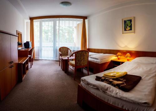 Postel nebo postele na pokoji v ubytování Hotel Bezdez Stare Splavy