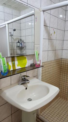 a bathroom with a sink and a mirror at Dongshan River Left Bank in Wujie
