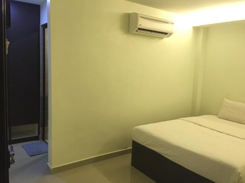 Ένα ή περισσότερα κρεβάτια σε δωμάτιο στο Desa house hotel