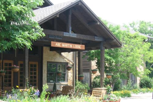 a building with a sign on the front of it at Abe Martin Lodge & Cabins in Nashville