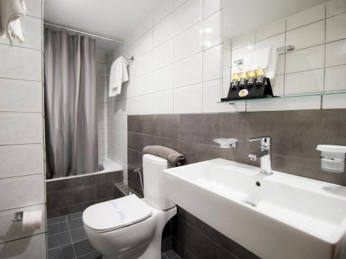 Kúpeľňa v ubytovaní Hotel Lithaion