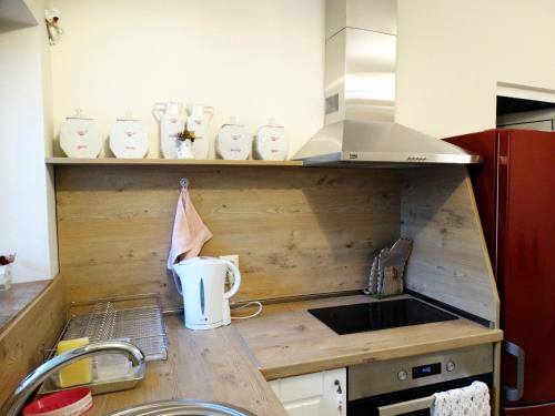 a small kitchen with a sink and a counter top at ROYAL apartment in Gabrovo