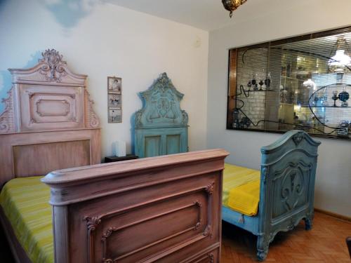 a bedroom with a bed and a dresser at ROYAL apartment in Gabrovo