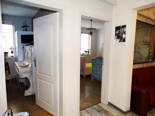 a room with a door open to a room with a bedroom at ROYAL apartment in Gabrovo