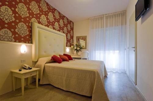 Postel nebo postele na pokoji v ubytování Hotel Foschi-Peninsula