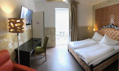 Hotel Vogelweiderhof tesisinde bir odada yatak veya yataklar