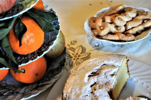 a table with a plate of bread and a bowl of nuts at Masseria Del Crocifisso in Polignano a Mare