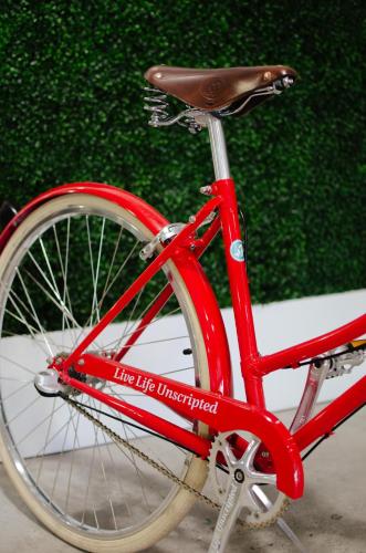 a red bike with the life university written on it at Unscripted Durham, Part of JDV by Hyatt in Durham