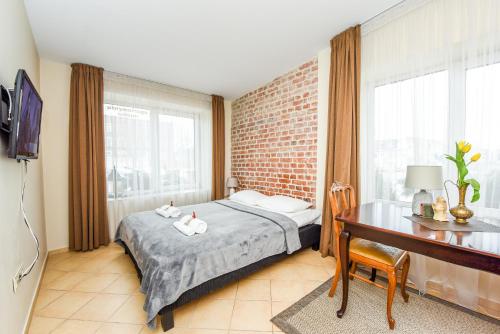 Postel nebo postele na pokoji v ubytování Kubu Apartment