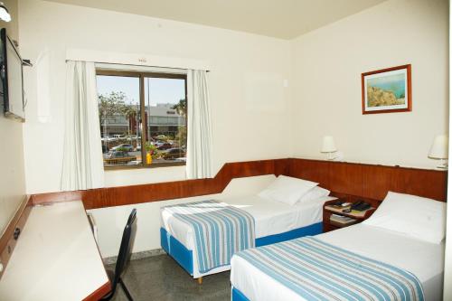 Tempat tidur dalam kamar di Villalba Hotel