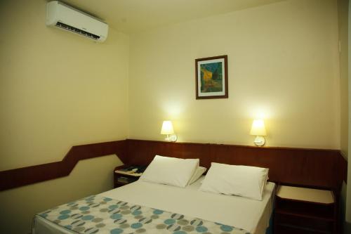 Ένα ή περισσότερα κρεβάτια σε δωμάτιο στο Villalba Hotel