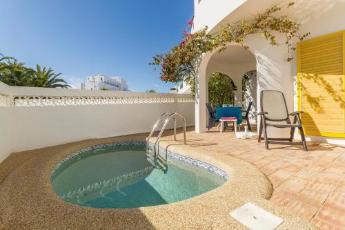 a swimming pool in the backyard of a house at Casa Tulipa in Luz