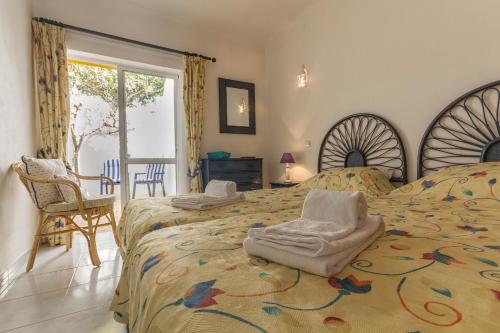 Ένα ή περισσότερα κρεβάτια σε δωμάτιο στο Casa Tulipa