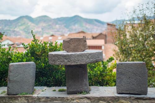 a stone monument with two stones on top at Amaru Inca in Cusco