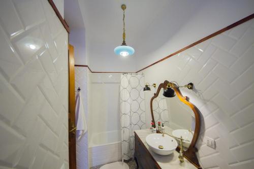 a bathroom with a sink and a toilet and a shower at Aminta Home in Las Palmas de Gran Canaria