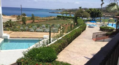 a swimming pool with a view of the ocean at “villa with a pool in a fantastic location” Protaras Villa 49 in Protaras