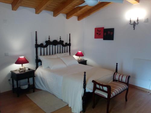 En eller flere senge i et værelse på Retiro da Madalena