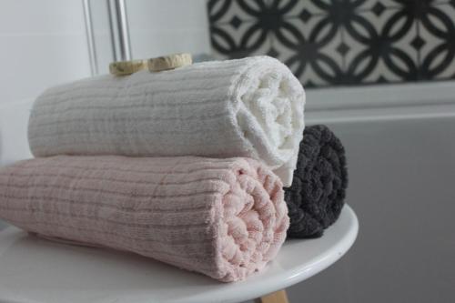a stack of towels sitting on a table at "Donnelly House" in Tenterfield