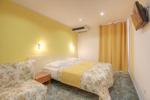 Postel nebo postele na pokoji v ubytování Hotel Sali