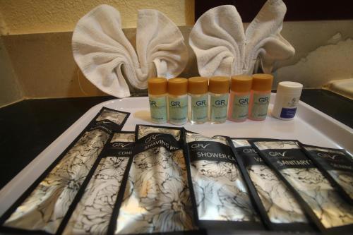a group of products sitting on a table next to bottles at Grand Riverview Hotel in Kota Bharu