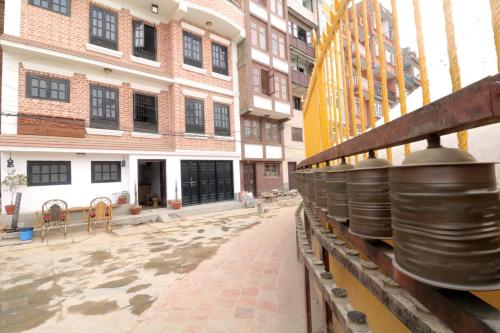 a view of a street with some buildings at Easy Homes - Ashok Stupa in Pātan
