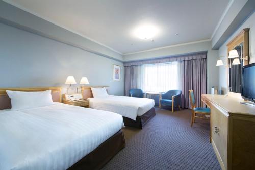 Cama o camas de una habitación en Hotel Agora Regency Osaka Sakai