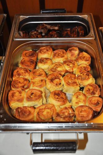 a pan full of food in an oven at Gasthof Liederhalle in Aalen