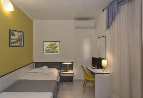 Postel nebo postele na pokoji v ubytování Hotel Amalfitana
