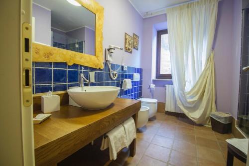 a bathroom with a sink and a toilet at Hotel Cristallo in Alagna Valsesia