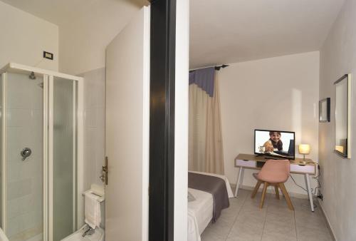 TV a/nebo společenská místnost v ubytování Hotel Amalfitana