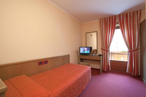 Postel nebo postele na pokoji v ubytování Hotel Krone