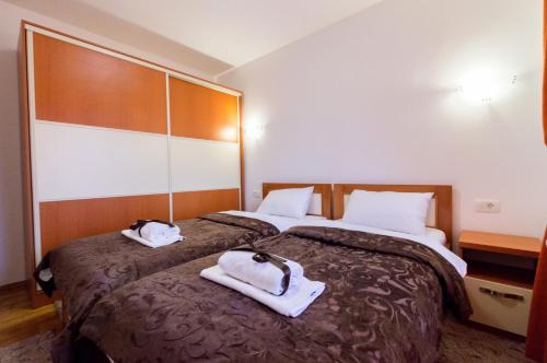 Ένα ή περισσότερα κρεβάτια σε δωμάτιο στο Apartments Nella