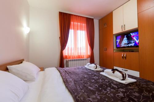 Ένα ή περισσότερα κρεβάτια σε δωμάτιο στο Apartments Nella