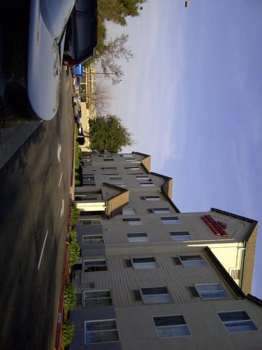 a tall building with many windows on the side of it at Hawthorn Suites by Wyndham Rancho Cordova/Folsom in Rancho Cordova