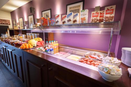 a buffet line with many different types of food at Hotel Santa Maria in Rotterdam