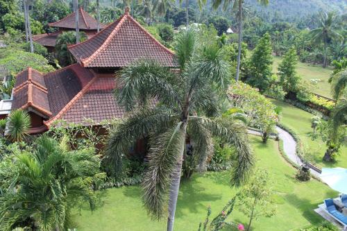 an aerial view of a resort with a palm tree at Villa Campi Sorga in Senggigi 