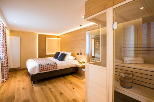 Letto o letti in una camera di Hostellerie Des Châteaux & Spa
