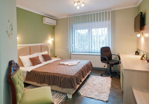 Ein Bett oder Betten in einem Zimmer der Unterkunft Garni Hotel Lama