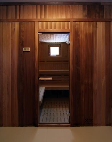 a wooden cabinet with a small window in it at Osada Osjaków in Osjaków