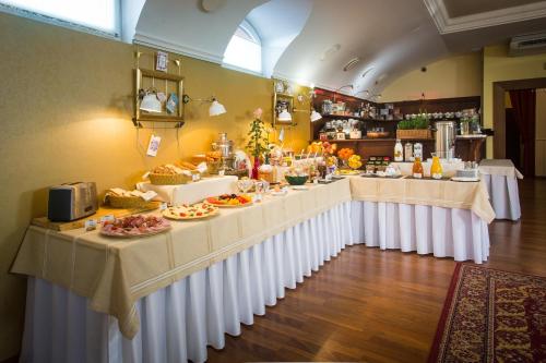 a buffet line with food on display in a restaurant at Hotel Bojnický vínny dom in Bojnice