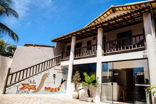 a building with a mural on the side of it at Pousada Stella Tropical in Salvador