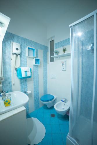 a bathroom with a toilet and a sink and a shower at Green Line in Rome