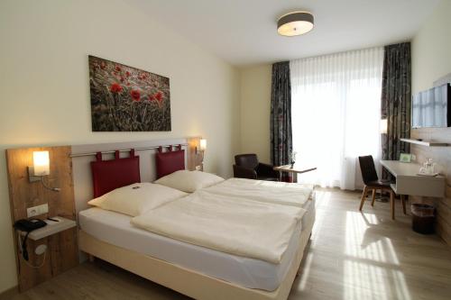 Ένα ή περισσότερα κρεβάτια σε δωμάτιο στο Hotel am Pferdemarkt