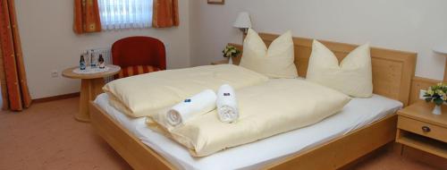 Posteľ alebo postele v izbe v ubytovaní Gasthaus Gumping