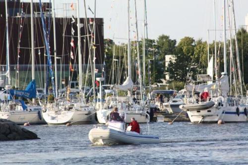 a group of boats are docked in a harbor at Cozy Summer House with Free Parking near City Center & Beach in Kuressaare