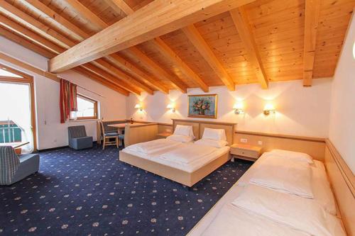 En eller flere senge i et værelse på Gasthof Bad Hochmoos