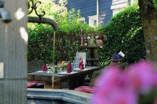 a picnic table with wine glasses on top of it at Feste Neustadt in Bergneustadt