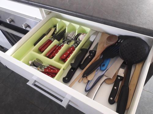 a drawer filled with lots of utensils at Un Spa au Canyon in Freyming