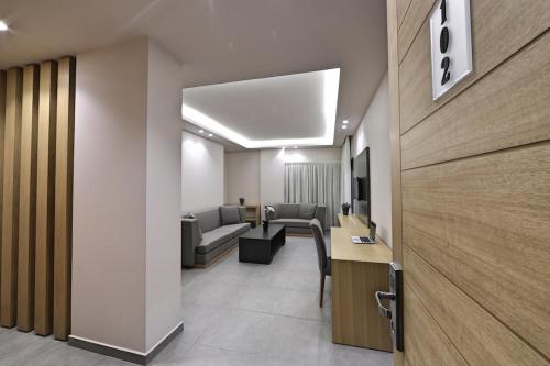 a lobby with a waiting room with couches and a table at The Residence 649 in An Naqqāsh
