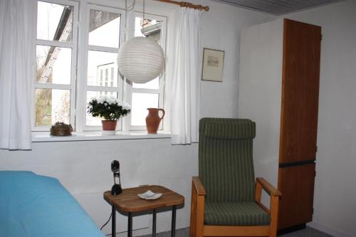 Un lugar para sentarse en Holmehuset Bed & Breakfast